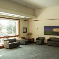 The lounge of the Cook-DeWitt Center facing the outside window.